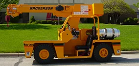 Side view of the Broderson IC-35 carry deck crane with boom stowed.