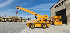 Broderson IC-400 Carry Deck Cranes staged outside the shop, ready for the next heavy pick.