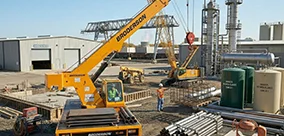 The Broderson IC-80 carry deck crane provides the heavy lifting and maneuvering power required for complex industrial site projecs.