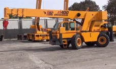 A Broderson RT-400 Crane is shown from the side with its boom lowered