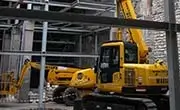 Maeda CC1485S-1 crawler crane operating within a steel-framed commercial building