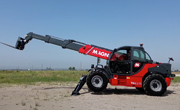 Magni HTH Telehandler lifting heavy loads in industrial yard