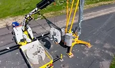 Potain EVY 30-23-4 T ballast installation during setup, using a support crane on site.