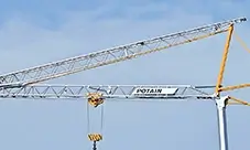 Potain EVY 30-23-4 T self-erecting crane with jib folded back and hook block suspended.