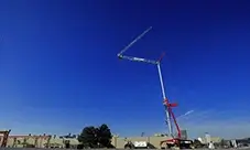 Potain EVY 30-23-4 T self-erecting crane set up and ready for daily lifts, with the jib raised for added clearance.