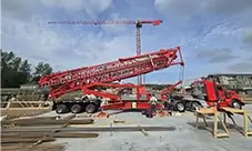 Potain Igo T 130 arriving on site ready for a fast setup and big reach.