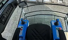 Potain Igo T 130 operator cab with simple controls and clear sightlines.