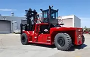 Taylor X925 Forklift operating on jobsite lifting steel beams