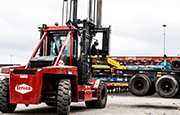 Taylor XH360L Heavy Duty Forklift operating on jobsite lifting truck container