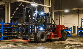 Taylor XH550M Heavy Duty Forklift left side profile inside a warehouse